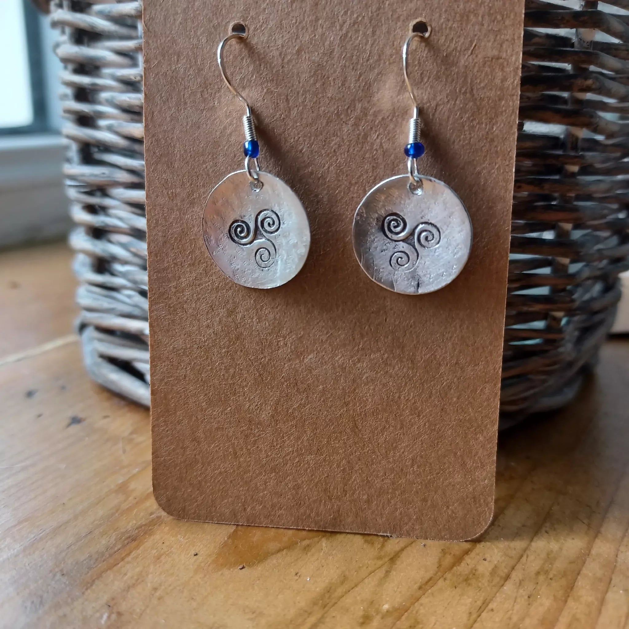 handmade hammered and stamped triskele earrings with silver hooks