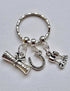 Graduation gift keyring with 3 charms; a scroll, a lucky horseshoe and two goblets, and the word ‘Cheers’. A super gift for a graduate.