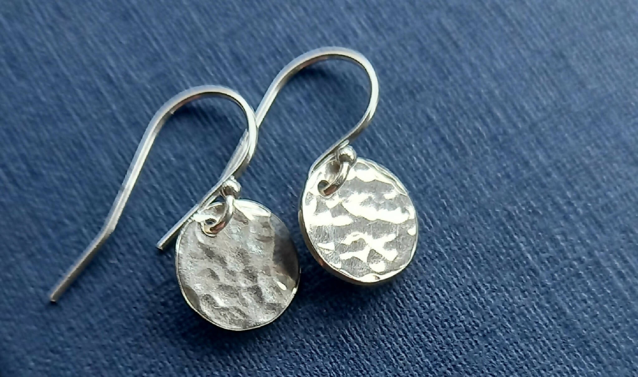 Hammered silver earrings.