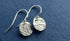 Hammered silver earrings.