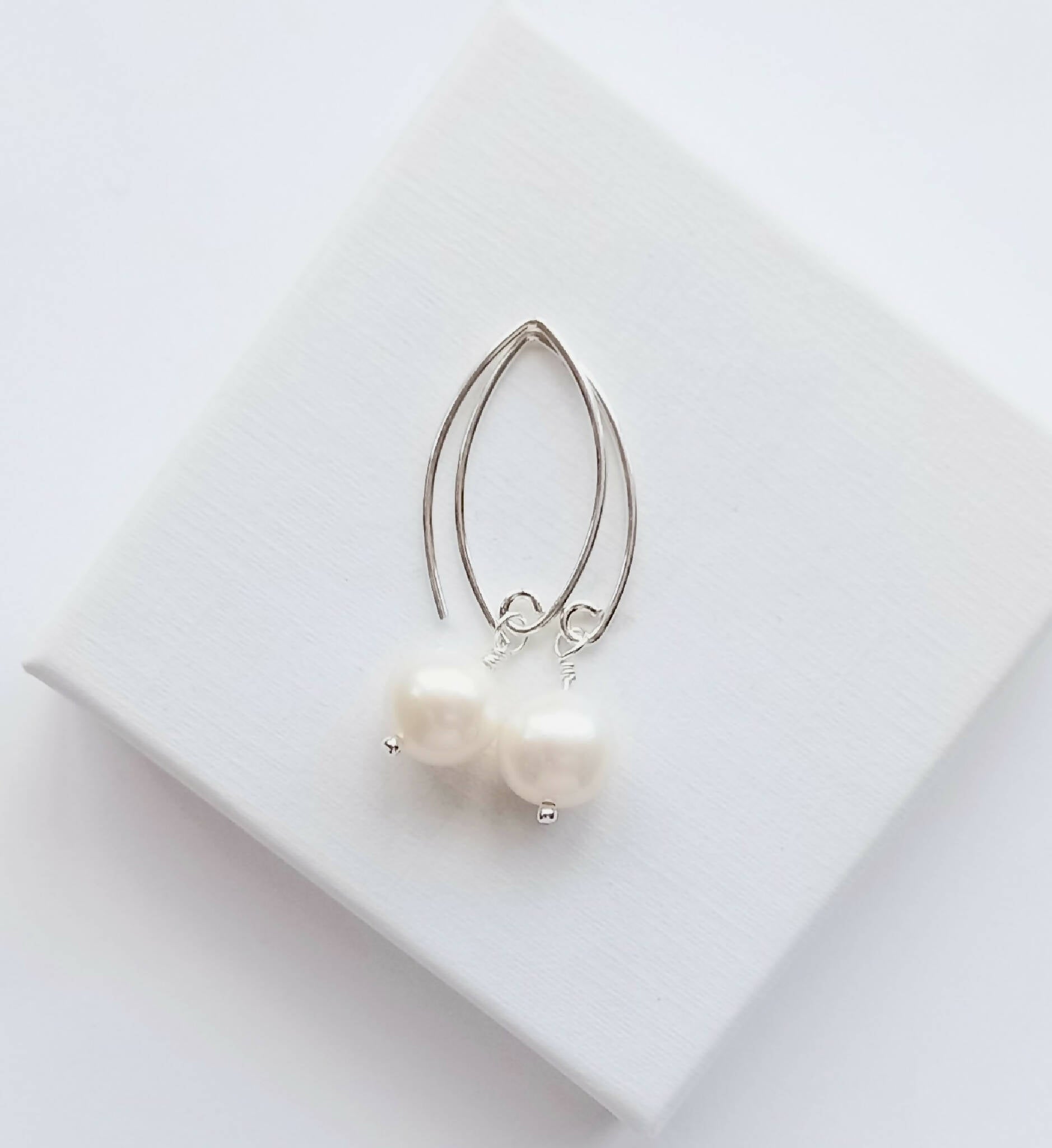 White pearl drop earrings