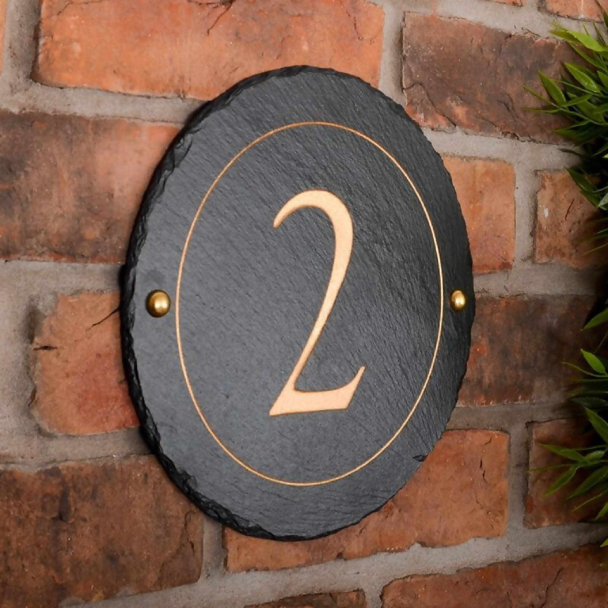 Round rustic slate house number