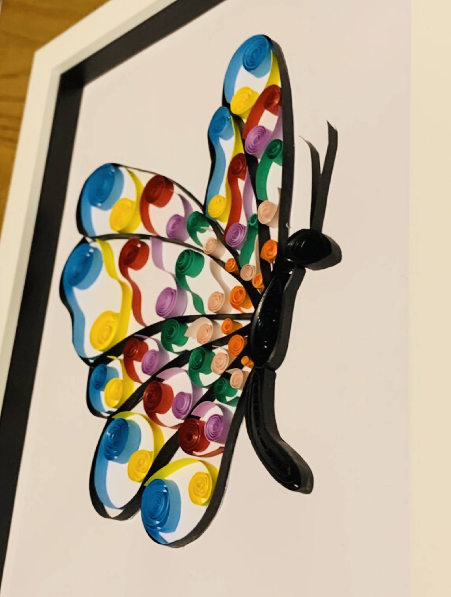 Quilled rainbow butterfly with white frame