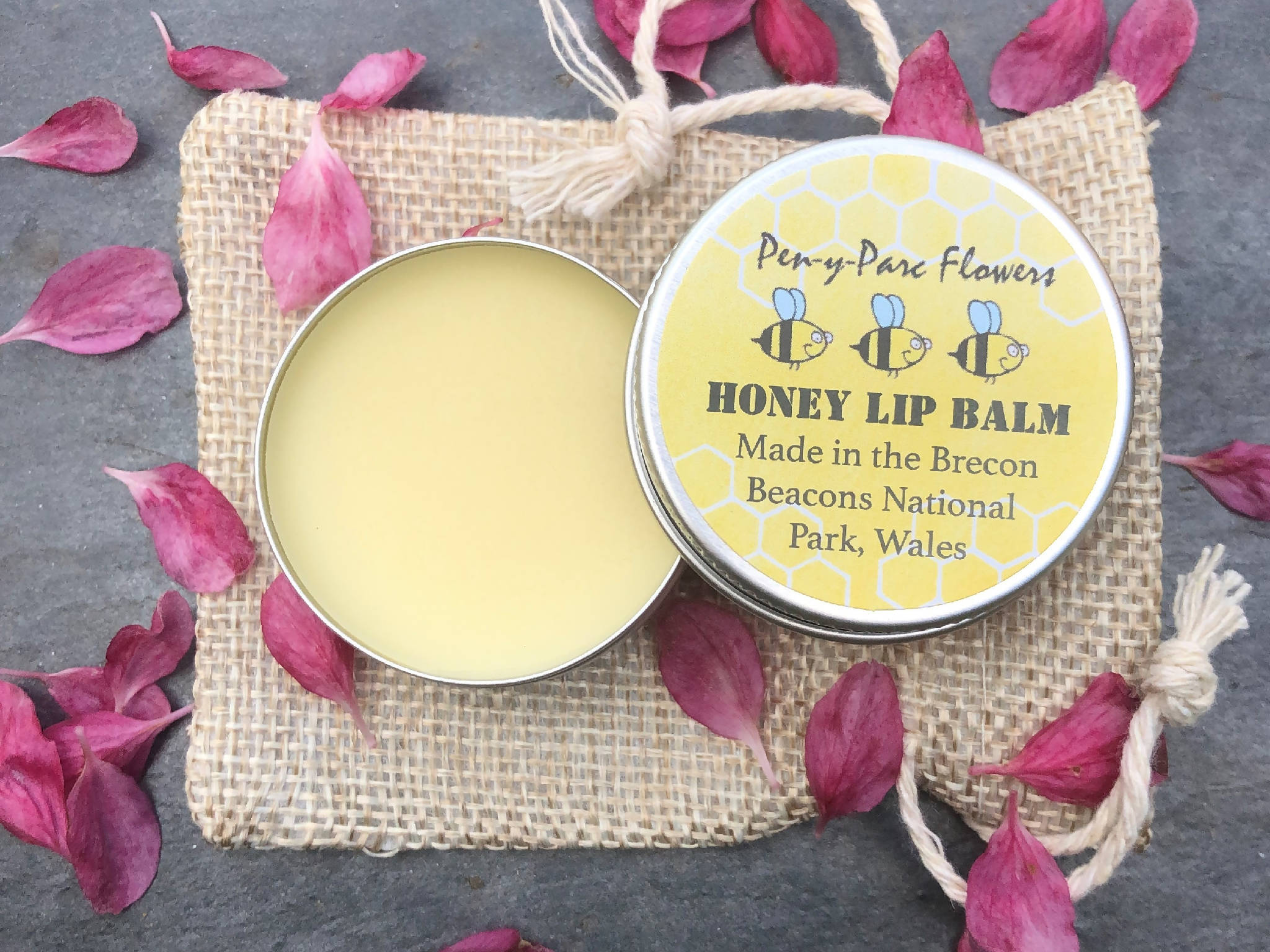 Handmade natural beeswax lip balm in jute gift bag