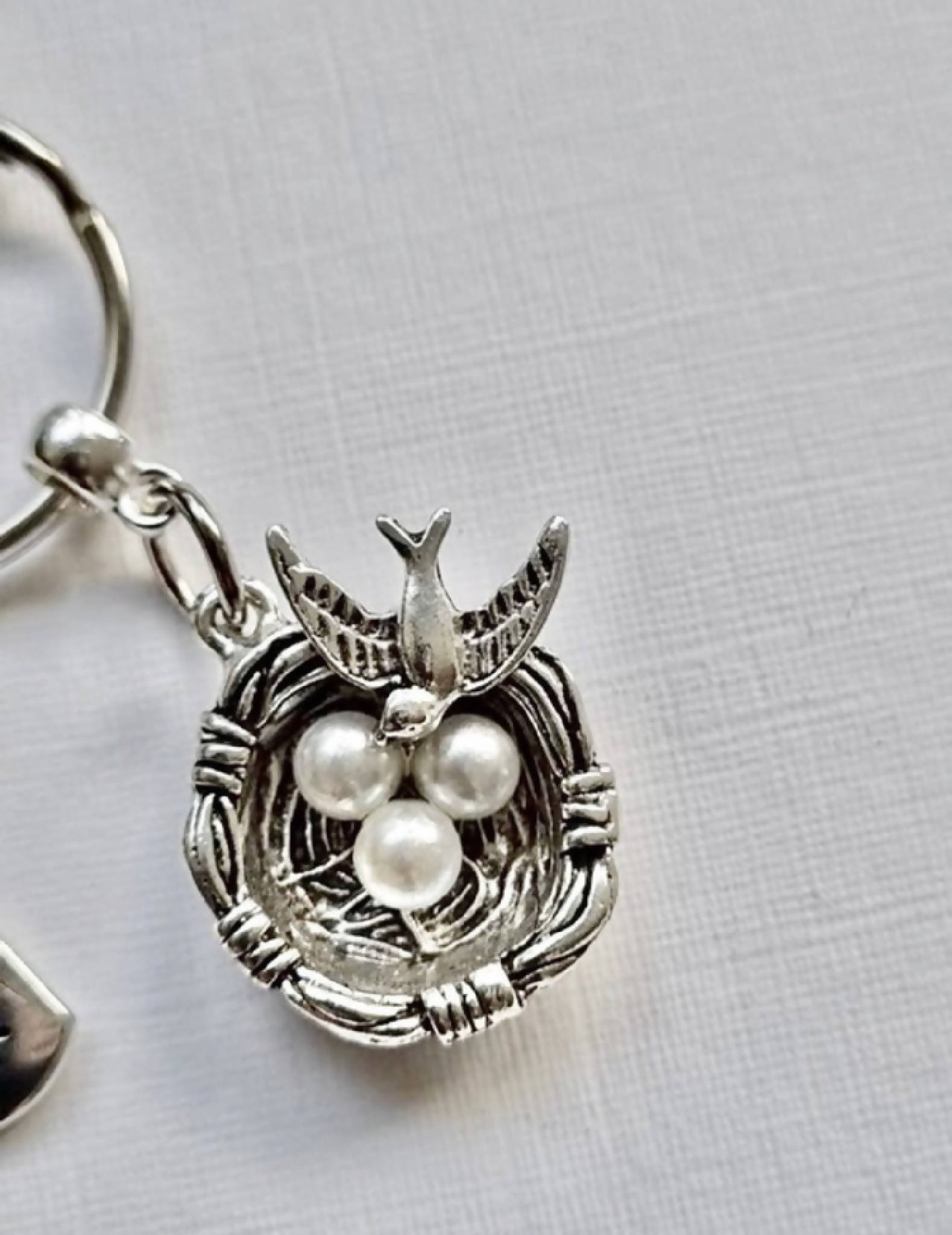 Beautiful silver tone bird and nest keyring/bag charm. Gorgeous little gift for new parent/s.